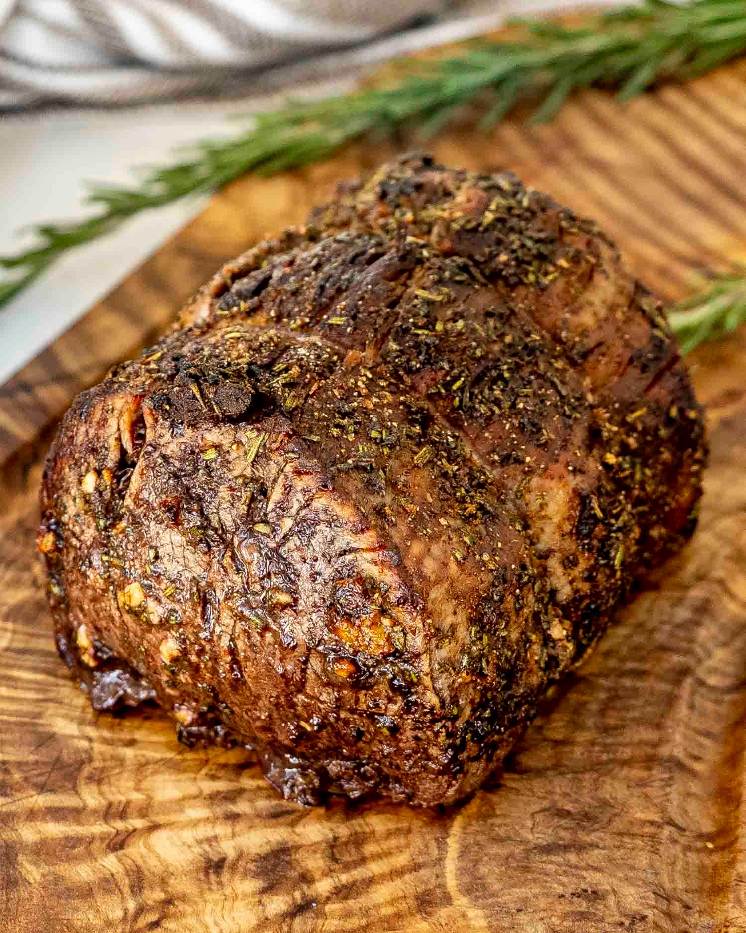 a roast beef made in the air fryer on a cutting board.
