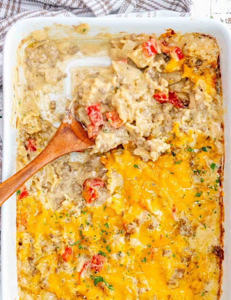 freshly made beef and noodle casserole in a white casserole dish.