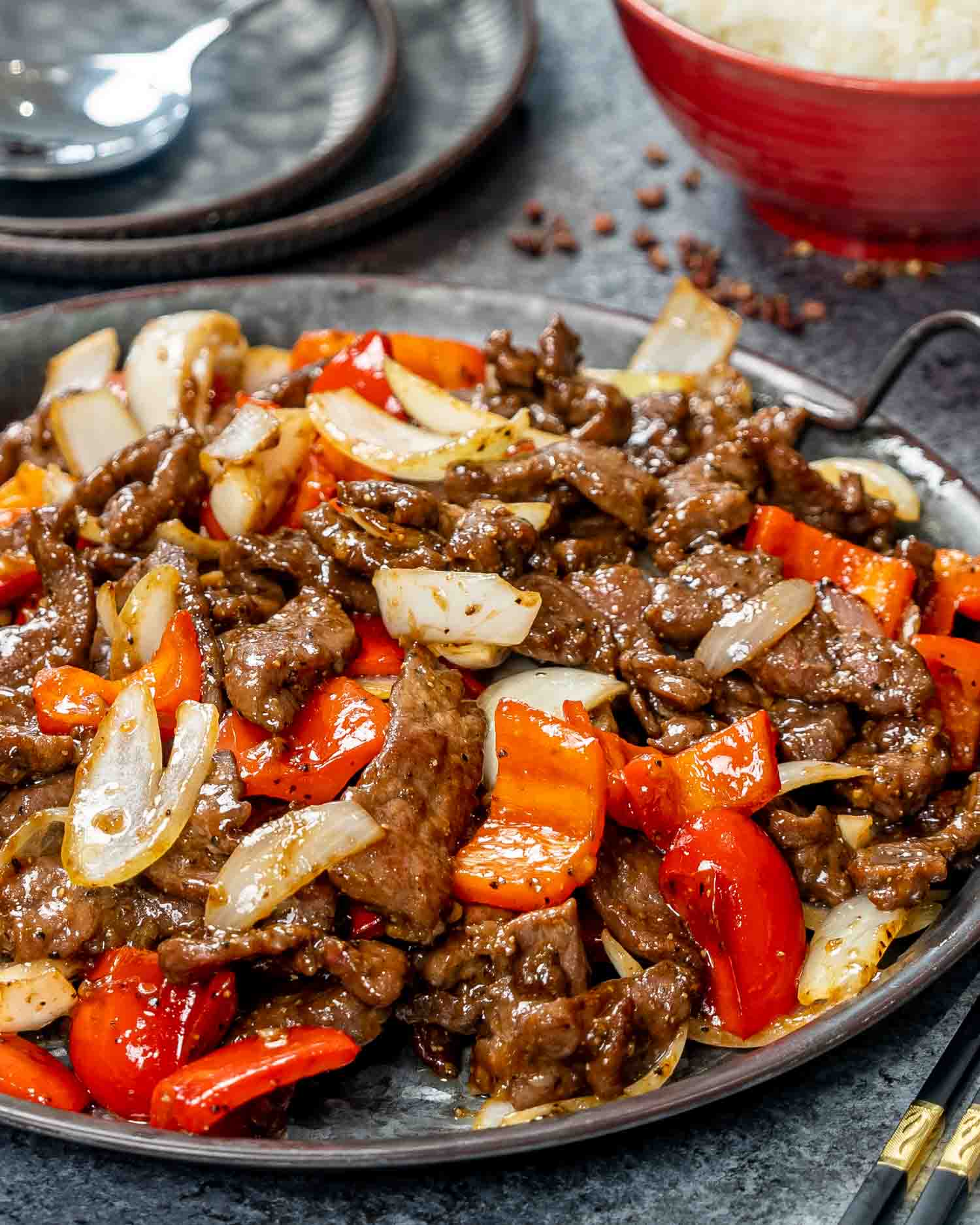 black pepper beef in a metal serving plate.