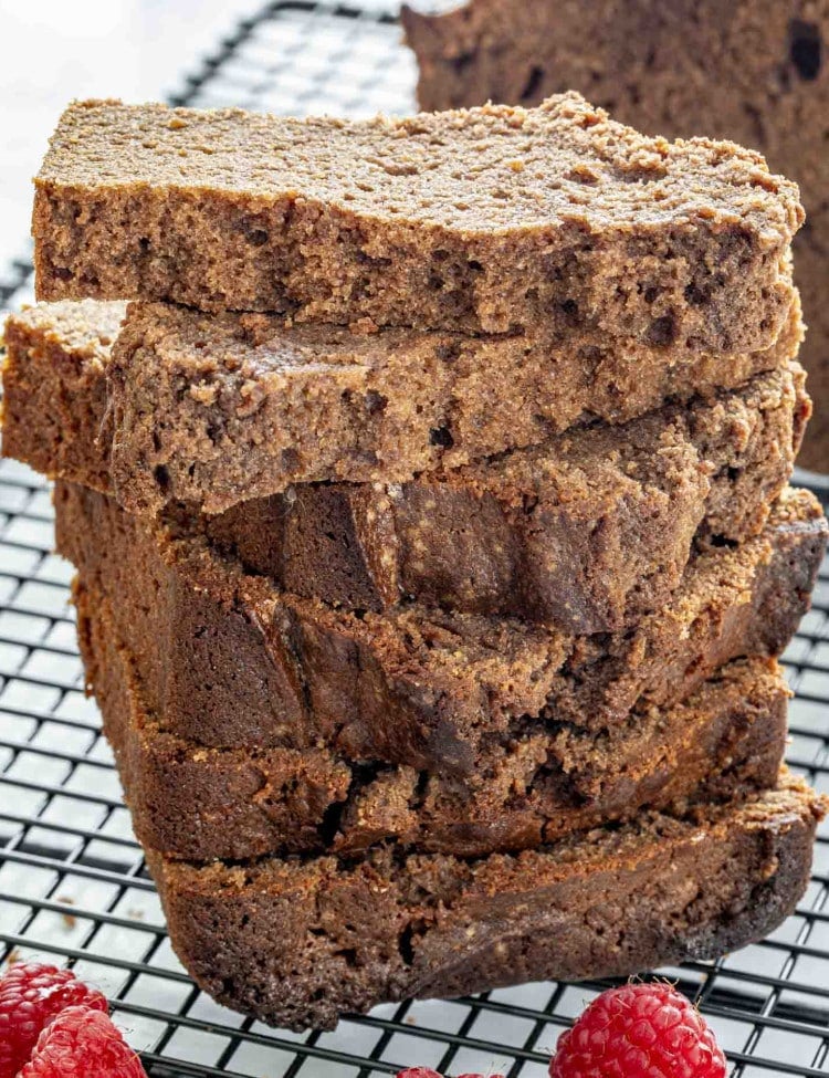 overhead shot of chocolate pound cake sliced on a cooling rack.