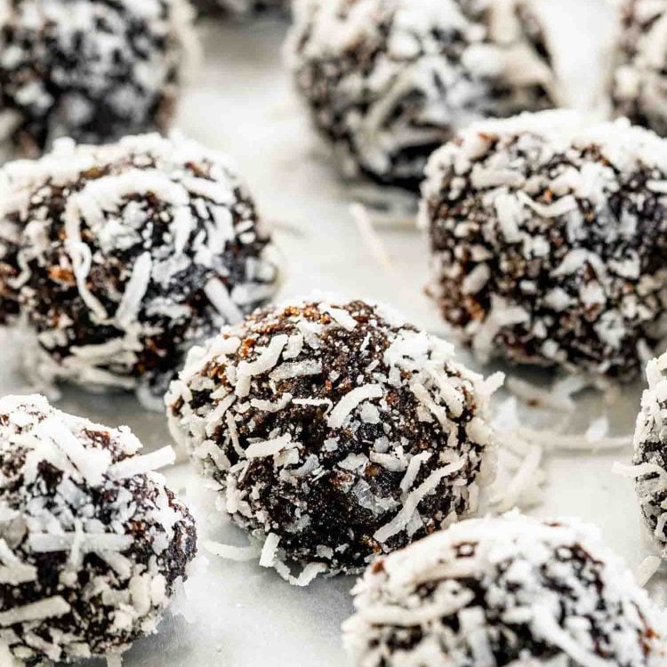 chocolate rumballs on a baking sheet lined with parchment paper.