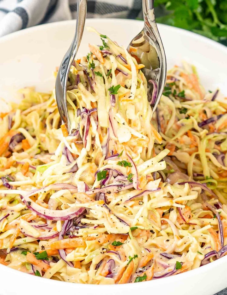 freshly made coleslaw in a large white bowl.