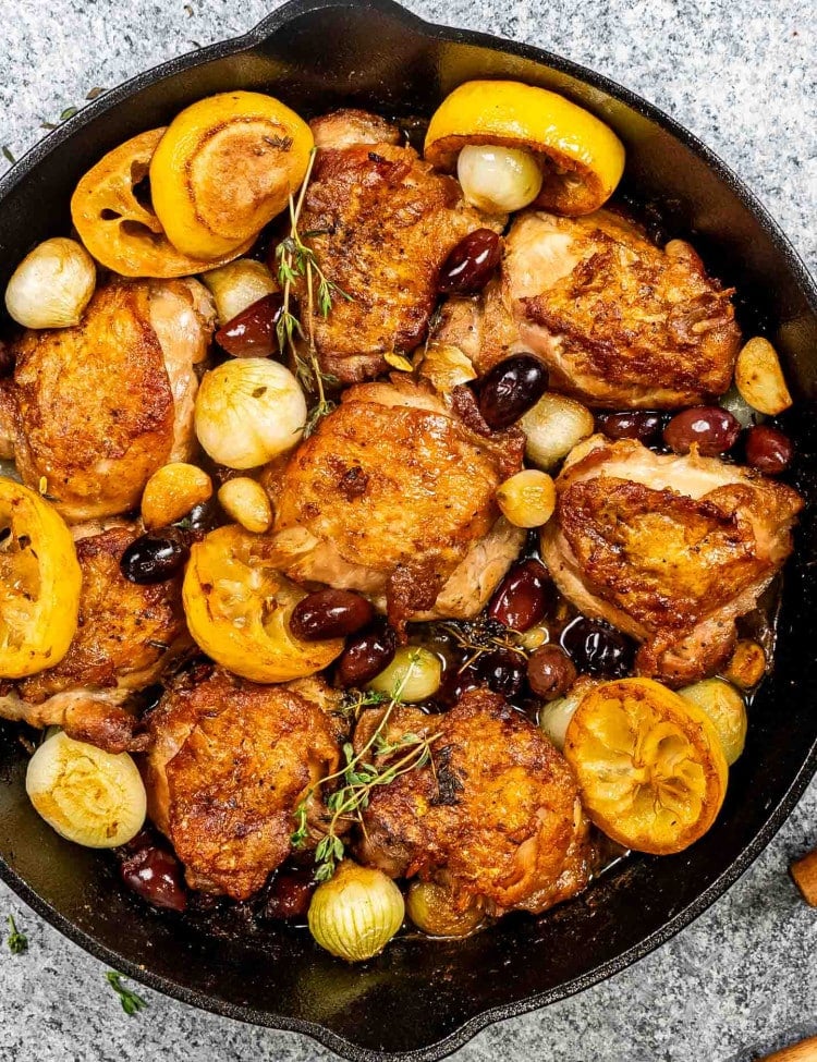 greek chicken thighs in a skillet.