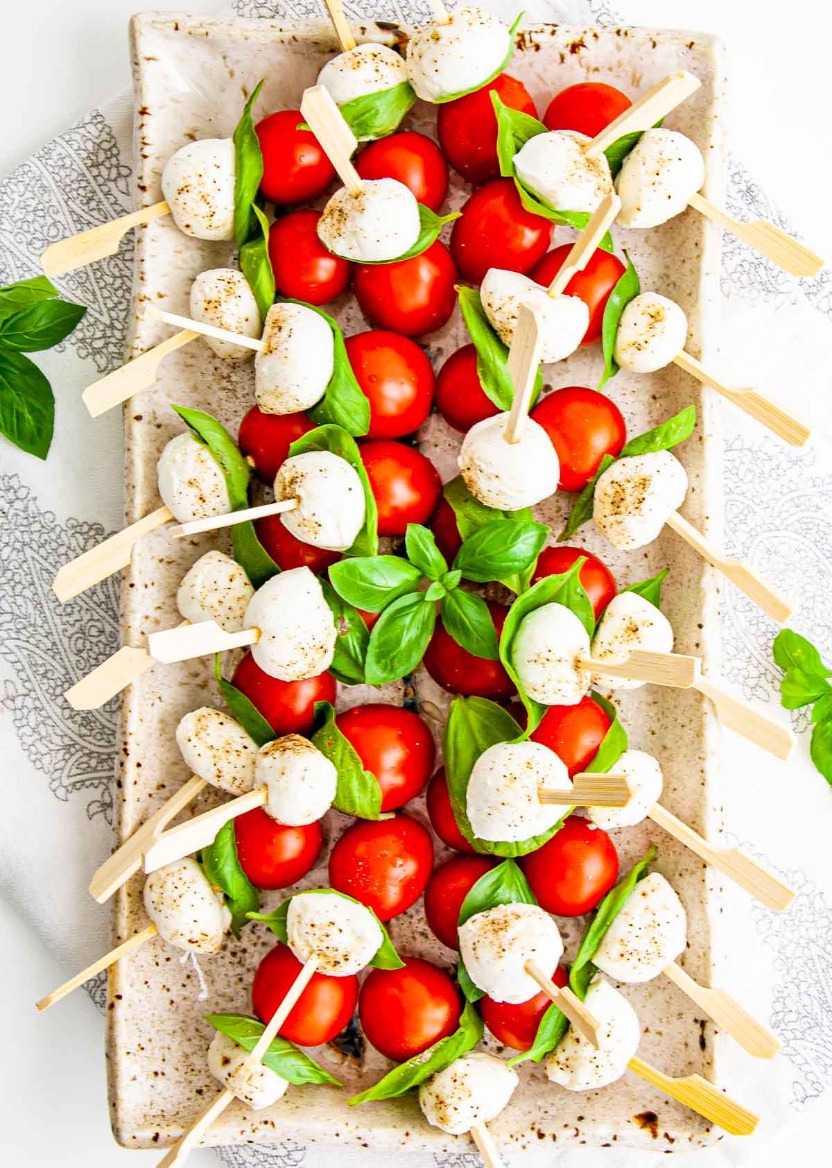caprese salad bites on a serving platter 