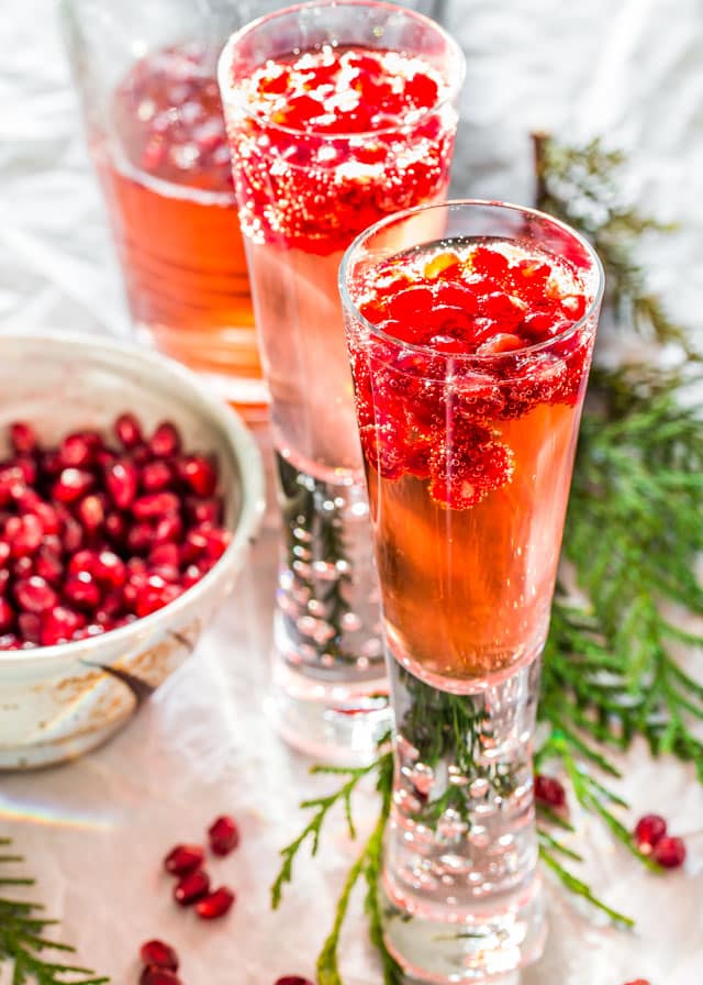 Pomegranate Elderflower Spritzers topped with pomegranate seeds