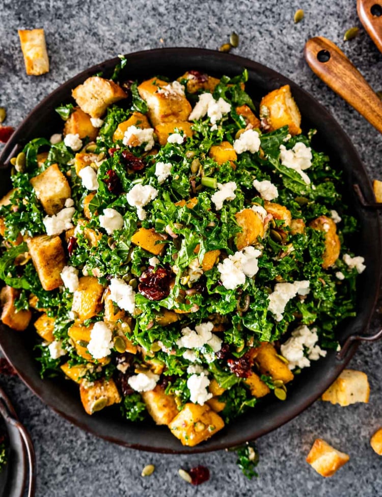roasted pumpkin panzanella salad in a metal platter.