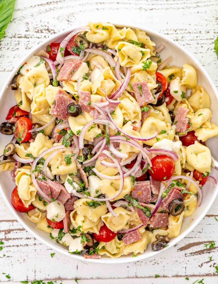 fresh tortellini pasta salad in a large serving bowl.